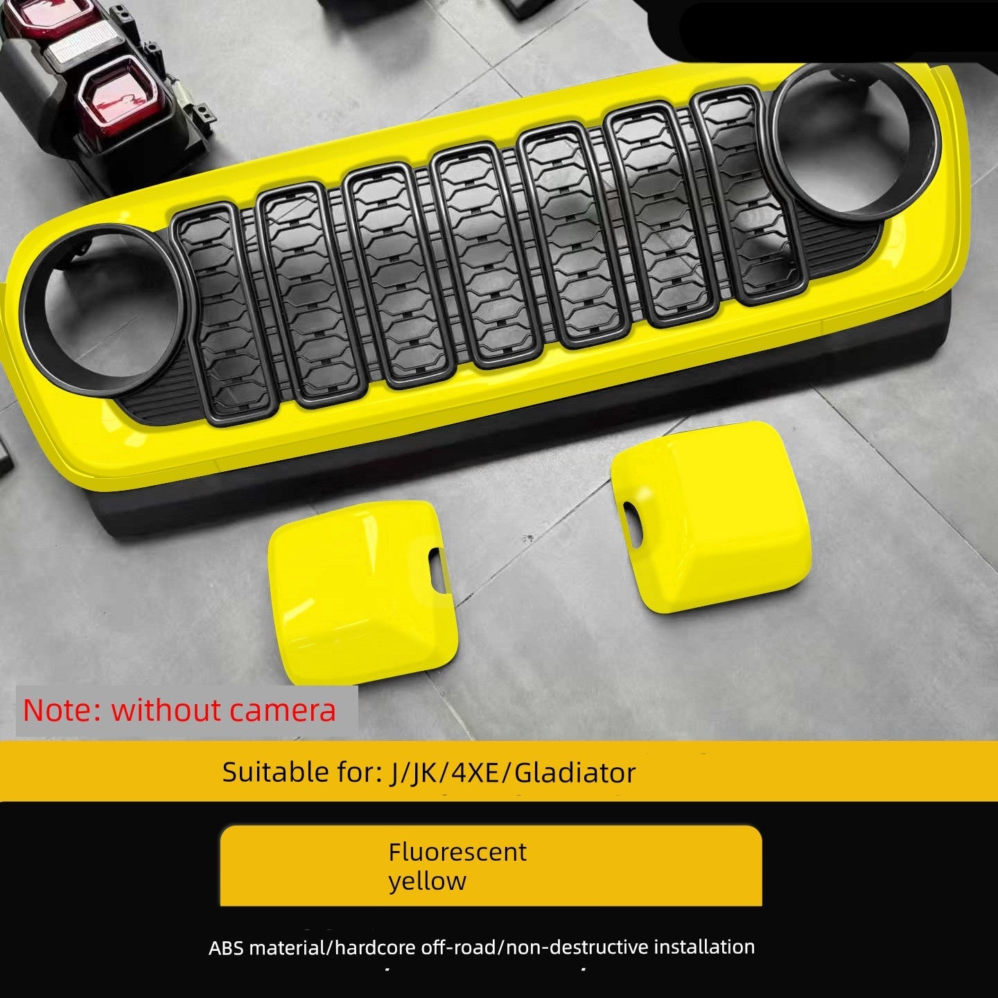 Yellow and black off-road bumper with two additional yellow parts on a gray surface.