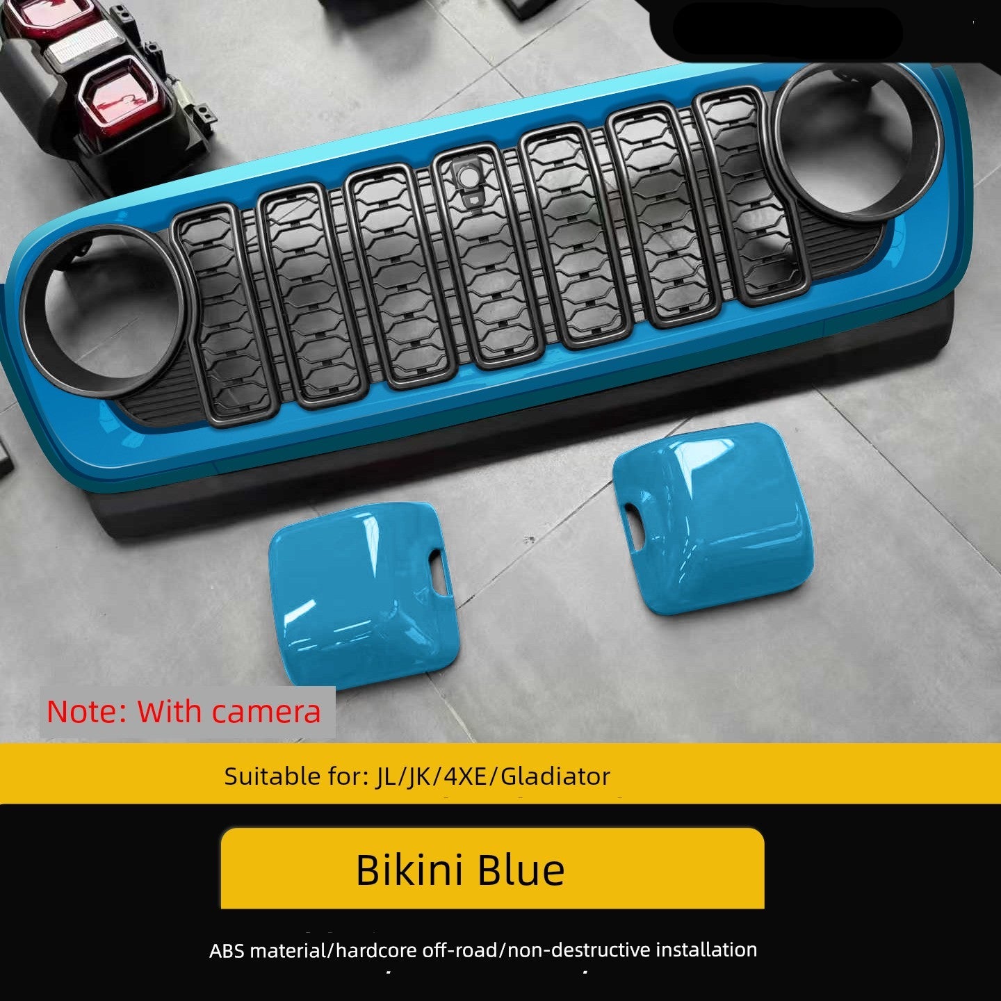 Blue car bumper guard with two smaller blue covers on a gray surface.